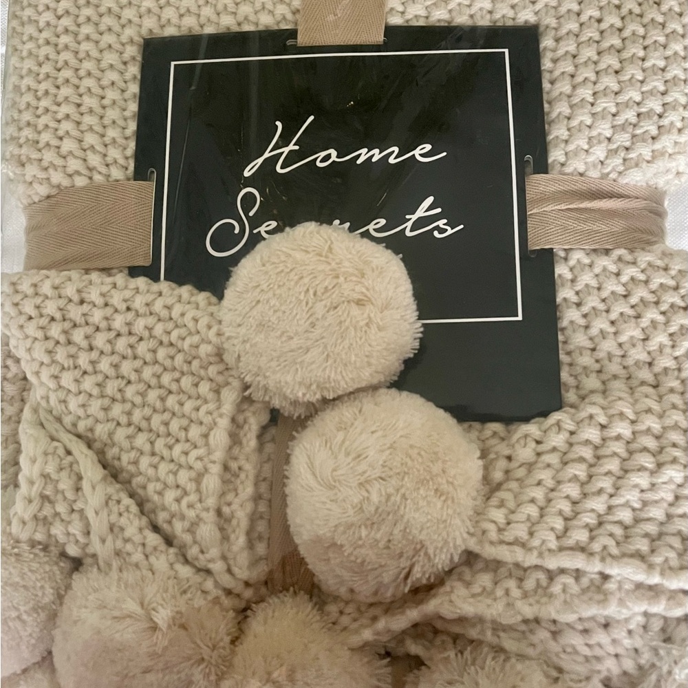 “Modern Threads” Knit Throw in Sand; 1.27 m. by 1.52 m. Imported.